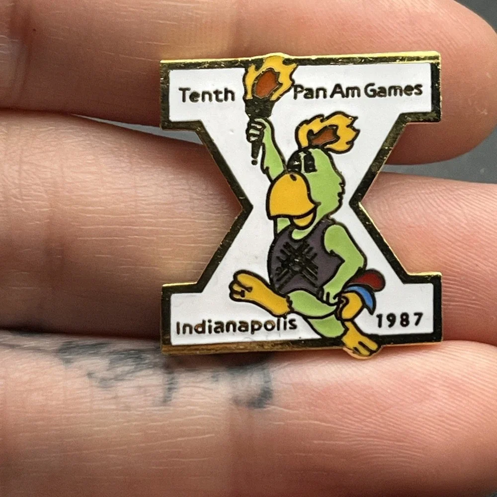 1987 Tenth Pan American Games Marsh Amigo Mascot Carrying Torch‎ Lapel Hat Pin